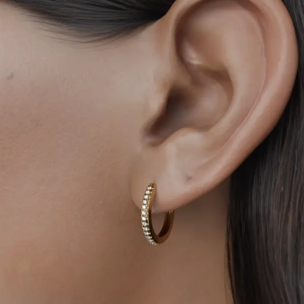 An elegant piece designed to reflect the soft whispers of your deepest thoughts. Produced with love and care, these earrings symbolize inner peace and self-discovery. Each earring is adorned with sparkling gemstones that catch the light, reflecting the beauty of your soul.