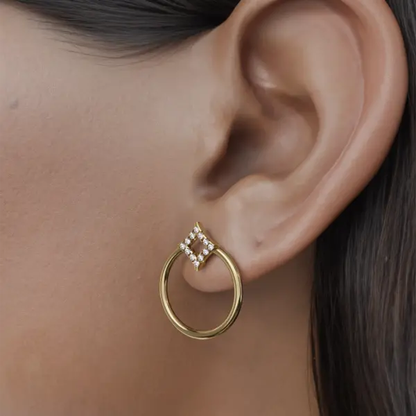 These earrings feature a fascinating design that combines a variety of geometric shapes, creating a modern yet timeless aesthetic. Shiny gold shines beautifully against sparkling diamonds that have been meticulously set to enhance their brilliance. Each geometric piece is carefully arranged to create a harmonious balance, making these earrings a striking and statement accessory for any occasion. Enrich your jewelery collection with this unique pair, where sophistication meets creativity in every detail.