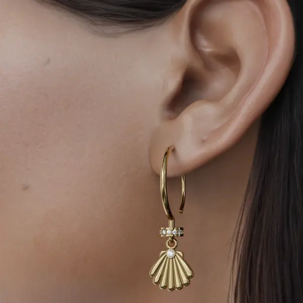 Dive into the depths of elegance with these elegant gold earrings, each a sparkling testament to the mysteries of the ocean. Designed to capture the charm of the deep sea, these Earrings are both lightweight and eye-catching. It is designed to take any combination to the next level and add a touch of the magic of the ocean to your daily style. With their unique designs and sparkling appearance, they remind us of the beauty that lies beneath the waves, making them not only a fashion statement but also a celebration of nature's art. Adorn yourself with these earrings and carry a piece of the ocean's story wherever you go.