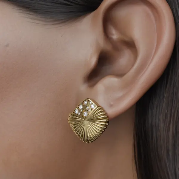 Introducing our exquisite earrings, where elegance meets artistry. The dazzling diamonds, skillfully positioned at the tip of each earring, create a striking focal point that captures the light beautifully. Inspired by the delicate shape of an open fan, these earrings exude sophistication and charm. Each diamond is meticulously set to enhance the overall design, drawing the eye and adding a touch of opulence to any outfit. Perfect for both special occasions and everyday wear, these earrings are sure to become a cherished addition to your jewelry collection.