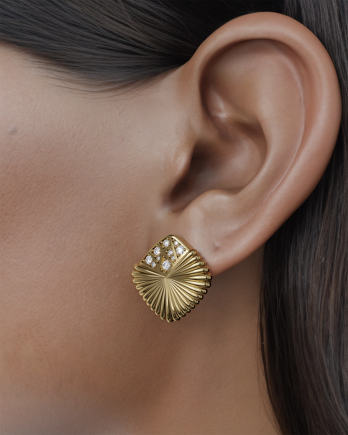 Introducing our exquisite earrings, where elegance meets artistry. The dazzling diamonds, skillfully positioned at the tip of each earring, create a striking focal point that captures the light beautifully. Inspired by the delicate shape of an open fan, these earrings exude sophistication and charm. Each diamond is meticulously set to enhance the overall design, drawing the eye and adding a touch of opulence to any outfit. Perfect for both special occasions and everyday wear, these earrings are sure to become a cherished addition to your jewelry collection.