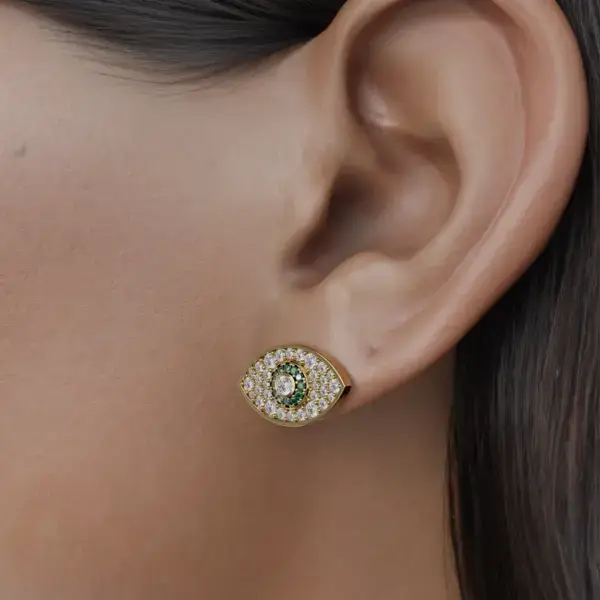 Meet our stunning Eye Shaped Evil Eye Earrings, meticulously crafted to blend contemporary elegance with a touch of ancient symbolism. Each earring features a striking eye motif, known for its protective properties against negative energy. A dazzling array of colored diamonds shine at the heart of the eye design, adding a vibrant hue and an air of luxury. Embrace your style with a charming touch and let the protective charm of the evil eye accompany you wherever you go.