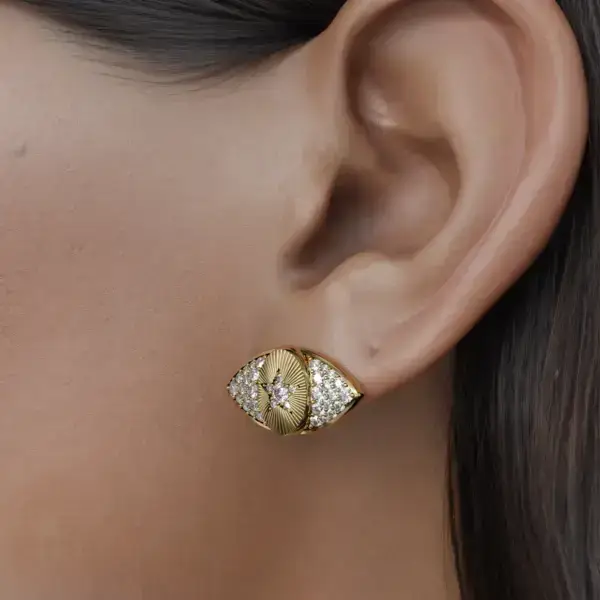 Meet our elegant eye-shaped diamond earrings, a striking testament to elegance and craftsmanship. These earrings are designed to catch light from every angle and create a stunning sparkle that enhances your natural beauty. With their unique eye silhouettes, they evoke a sense of glamor and mystery, making them the perfect statement piece for any occasion.