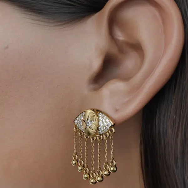 The unique allure of these earrings lies in their innovative dangling components, which sway gently as you move, casting a radiant display of light. Each piece is expertly designed to reflect your individuality, while the delicate balance of form and function ensures they are as comfortable as they are eye-catching.