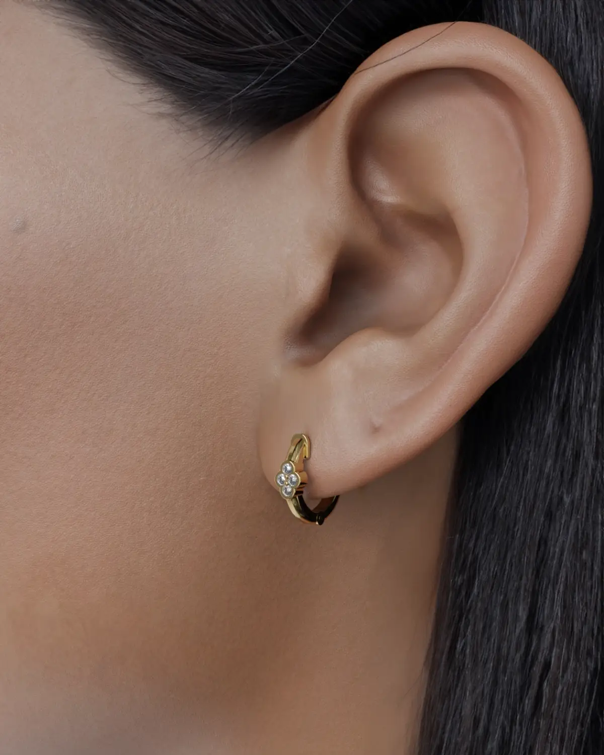 Introducing our Elegant Hoop Earrings, a stunning accessory that effortlessly blends sophistication with a touch of nature-inspired beauty. Each hoop features four delicately set small stones, meticulously chosen for their radiant colors and unique textures. The graceful curvature of the hoops highlights the gemstones, allowing them to catch the light beautifully and create a captivating shimmer with every movement.
