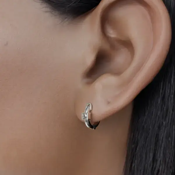 Made from high quality materials, these earrings have a shiny surface that captures the light beautifully and enhances the appeal of the stone in the square housing. Whether you choose to accent a vibrant gemstone or a stylish, understated stone, these earrings offer endless versatility. Perfect for both everyday wear and special occasions, these models can transition effortlessly from casual outings to elegant evenings.